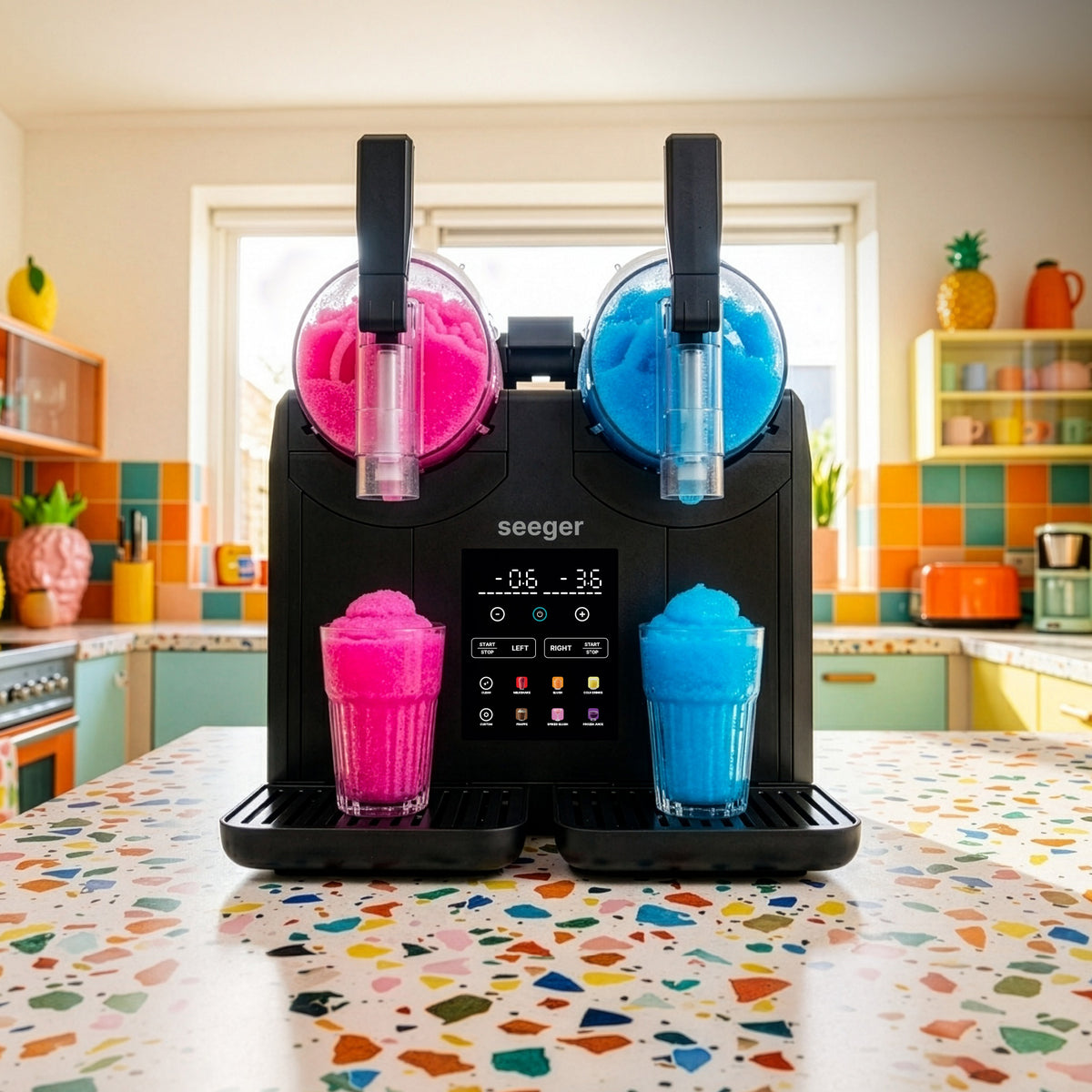 Slushie machine for home making two flavours of slush at the same time on a kitchen worktop