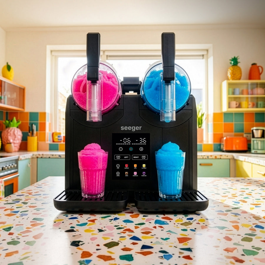 Slushie machine for home making two flavours of slush at the same time on a kitchen worktop